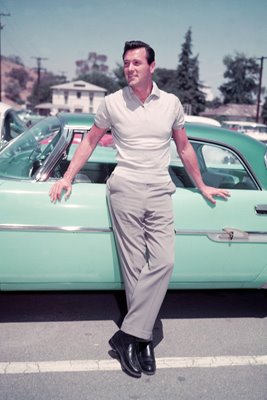 Rock Hudson leaning on car 1955