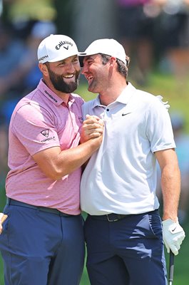 Jon Rahm Spain celebrates eagle with Scottie Scheffler USA Memorial Tournament 2023