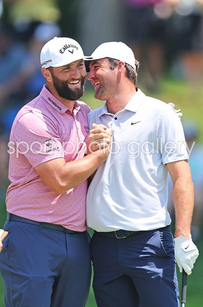 Jon Rahm Spain celebrates eagle with Scottie Scheffler USA Memorial Tournament 2023
