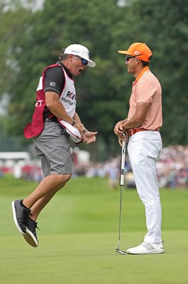 Rickie Fowler and caddie Ricky Romano celebrate Rocket Mortgage Classic win 2023
