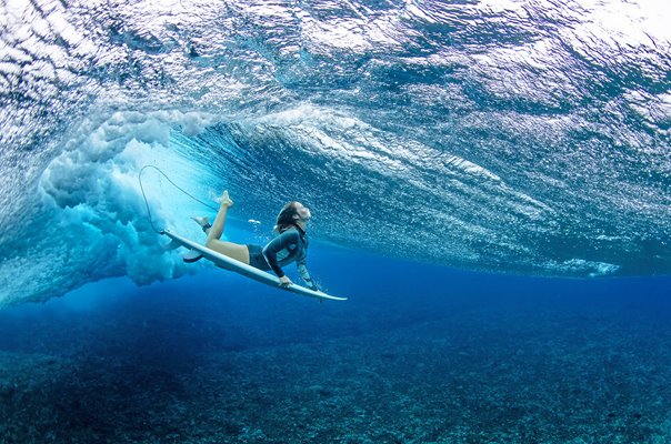Olivia Ottaway Australia dives under a wave Teahupoo French Polynesia 2023