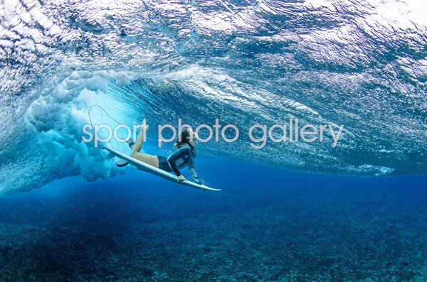 Olivia Ottaway Australia dives under a wave Teahupoo French Polynesia 2023