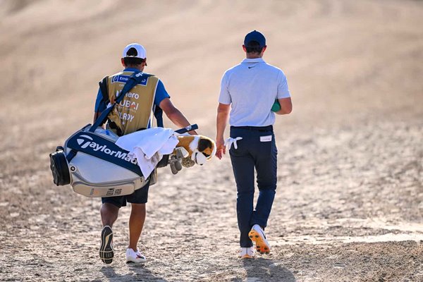 Rory McIlroy & caddie Harry Diamond walk towards Dubai Desert Classic win 2024