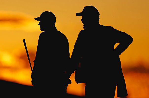 Jordan Spieth & caddie Michael Greller silhouette Phoenix Open 2024