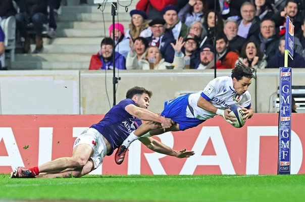 Ange Capuozzo Italy tackled by Damian Penaud as he scores v France Six Nations 2024