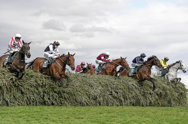 Horses clear The Chair fence during Grand National Aintree Liverpool 2024