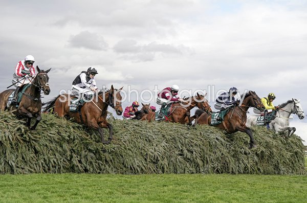 Horses clear The Chair fence during Grand National Aintree Liverpool 2024