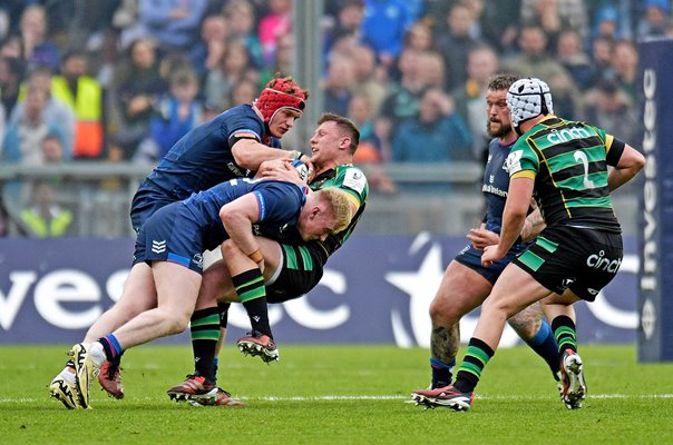 Fraser Dingwall Northampton tackled by Jamie Osborne & Josh van der Flier Leinster Champions Cup 2024