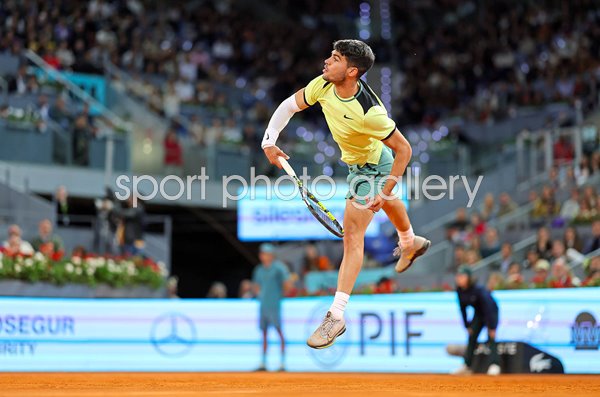 Carlos Alcaraz Spain serves v Andrey Rublev Madrid Open 2024