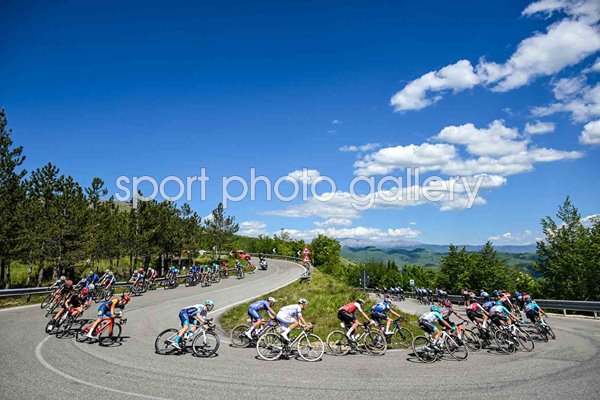 Peloton round a sharp bend Spoleto to Prati di Tivo Stage 8 Giro d'Italia 2024