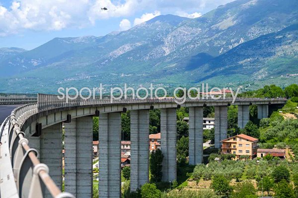 Peloton crosses bridge Avezzano to Naples Stage 9 Giro d'Italia 2024 