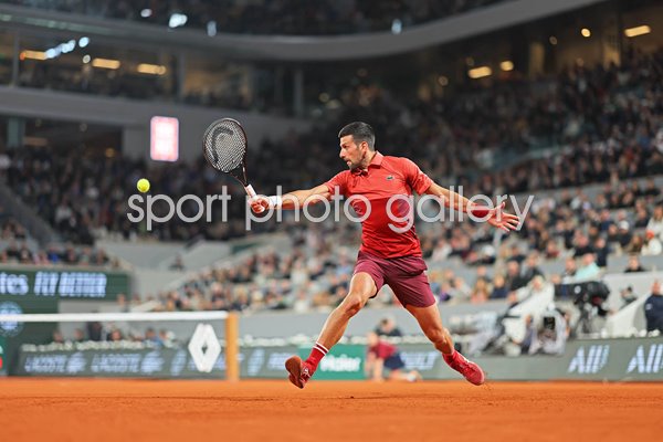 Novak Djokovic Serbia sliding backhand v Lorenzo Musetti French Open Paris 2024