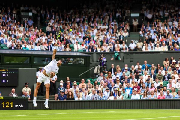 Carlos Alcaraz Spain serves Centre Court Wimbledon 2024