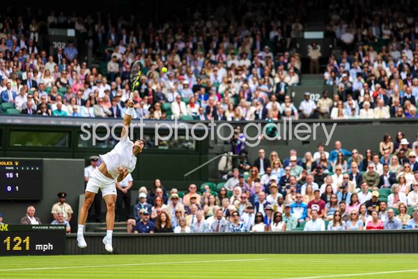 Carlos Alcaraz Spain serves Centre Court Wimbledon 2024