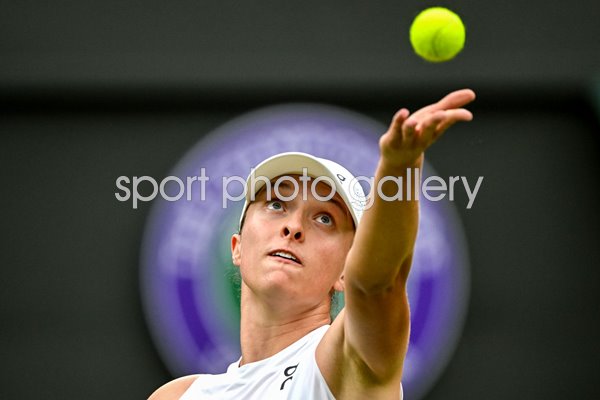 Iga Swiatek Poland serves against Sofia Kenin USA Wimbledon 2024