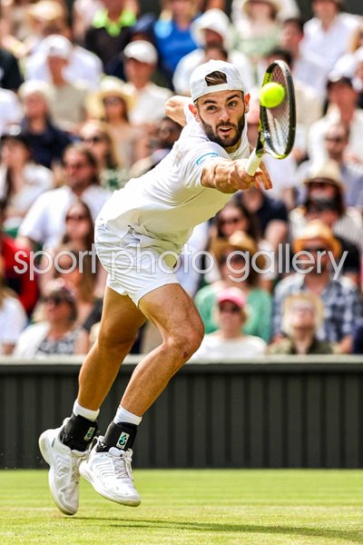 Jacob Fearnley Great Britain stretch backhand v Novak Djokovic Wimbledon 2024