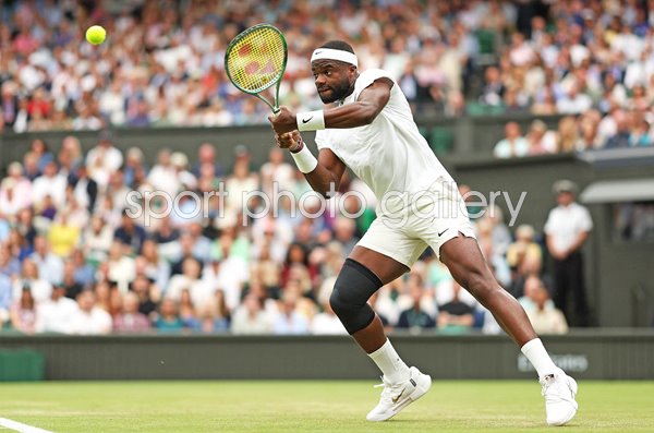 Frances Tiafoe USA backhand v Carlos Alcaraz Spain Wimbledon 2024