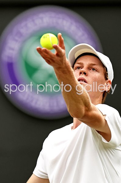 Jannik Sinner Italy serves v Ben Shelton USA Wimbledon Tennis Championships 2024