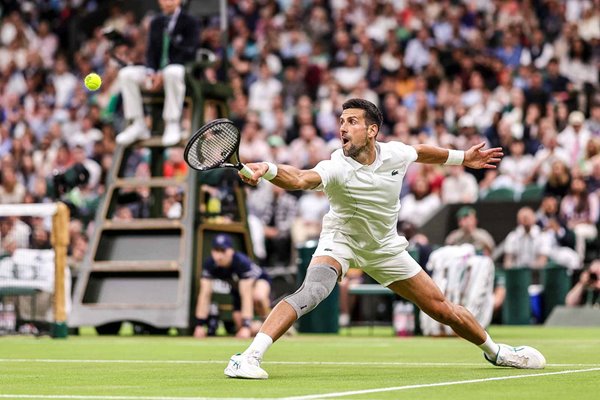 Novak Djokovic Serbia stretch backhand v Holger Rune Denmark Wimbledon 2024