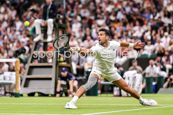Novak Djokovic Serbia stretch backhand v Holger Rune Denmark Wimbledon 2024