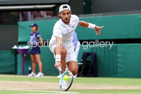 Lorenzo Musetti Italy low backhand v Taylor Fritz USA Wimbledon 2024