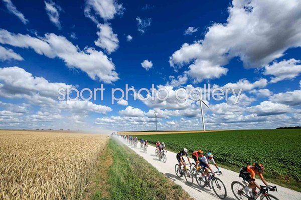 Peloton cycle through gravel section Stage 9 Tour de France 2024 