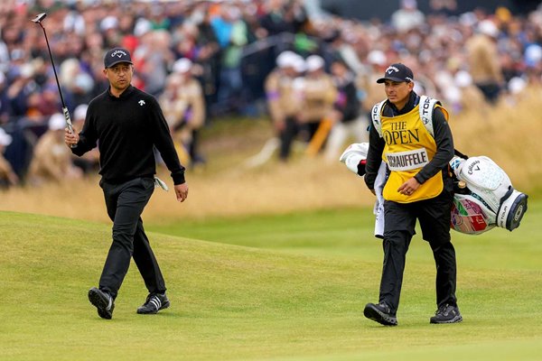 Xander Schauffele USA walks up 18th hole with his caddie Austin Kaiser Final Round British Open Troon 2024