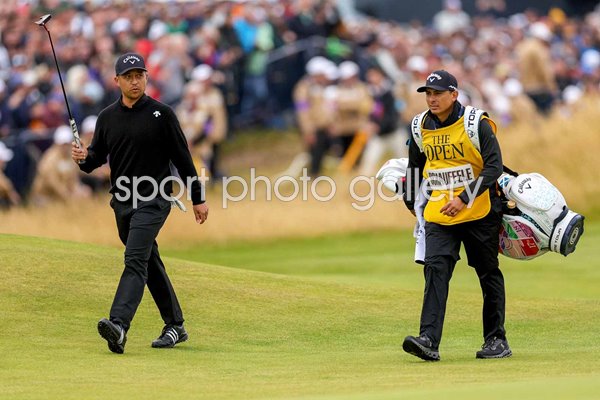 Xander Schauffele USA walks up 18th hole with his caddie Austin Kaiser Final Round British Open Troon 2024