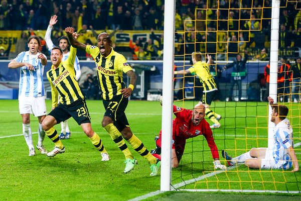 Felipe Santana (C) of Borussia Dortmund celebrates scoring winning goal