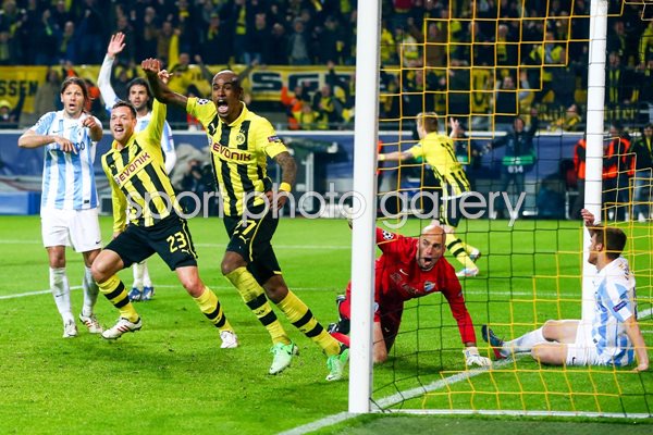 Felipe Santana (C) of Borussia Dortmund celebrates scoring winning goal