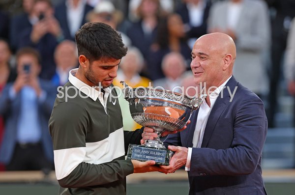 Andre Agassi USA presents trophy to Carlos Alcaraz Spain French Open Paris 2025