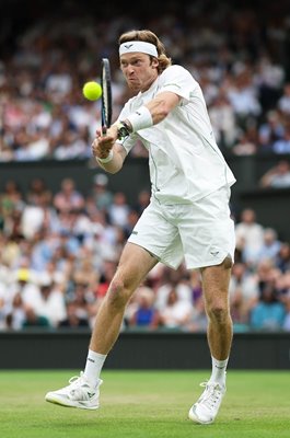 Andrey Rublev plays a backhand v Carlos Alcaraz Wimbledon 2025