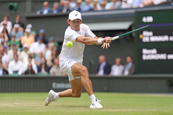 Alex De Minaur Australia plays a backhand v Novak Djokovic Wimbledon 2025
