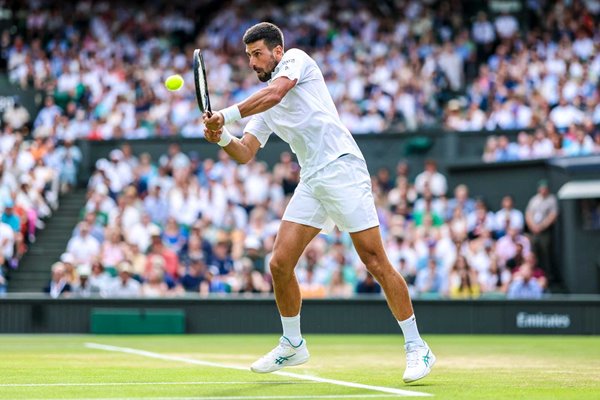 Novak Djokovic Serbia plays a backhand v Flavio Cobolli Wimbledon 2025