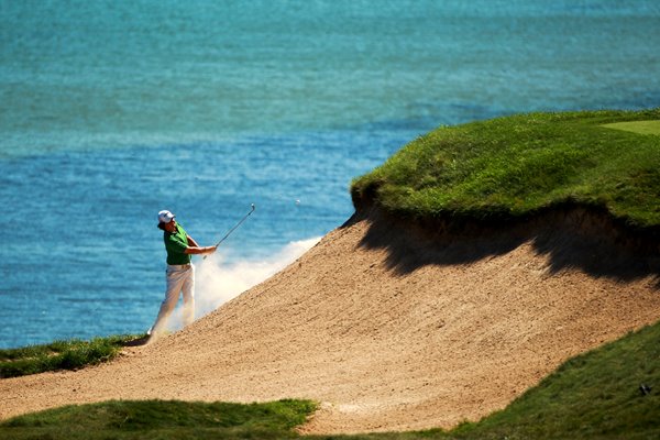 Rory McIlroy escapes from bunker on 3rd hole