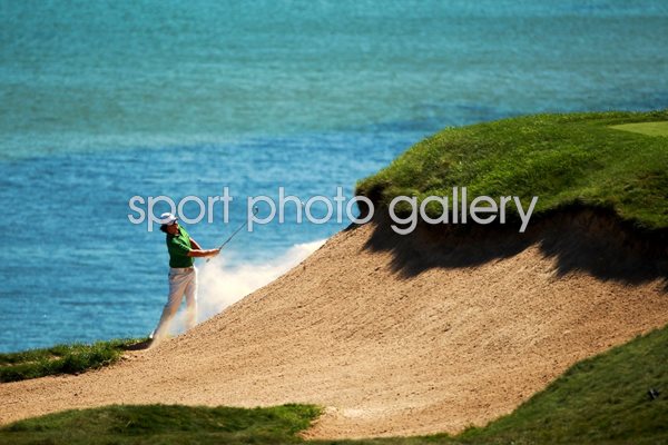 Rory McIlroy escapes from bunker on 3rd hole