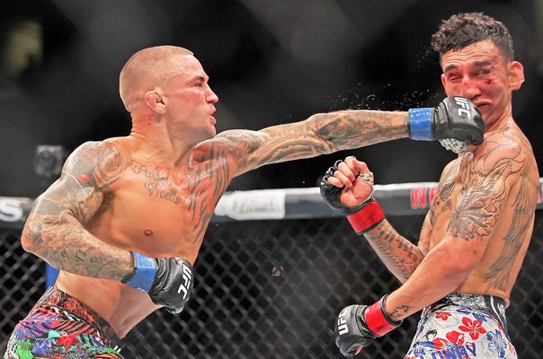 Dustin Poirier USA strikes Max Holloway USA UFC New Orleans 2025