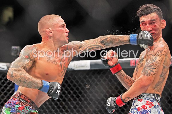 Dustin Poirier USA strikes Max Holloway USA UFC New Orleans 2025