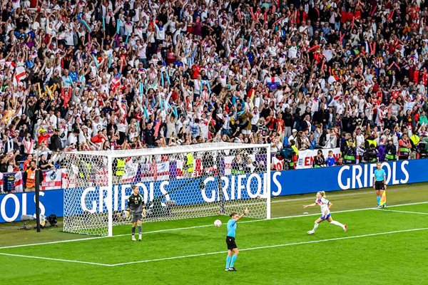 Chloe Kelly of England celebrates after scoring the winning penalty in the penalty shoot out during the UEFA Women's EURO 2025 Final.