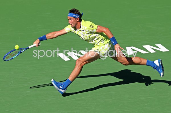 Casper Ruud Norway running forehand v Carlos Alcaraz Indian Wells 2026