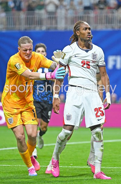 Djed Spence England raects after tackle v Giuliano Simeone semi final World Cup 2026