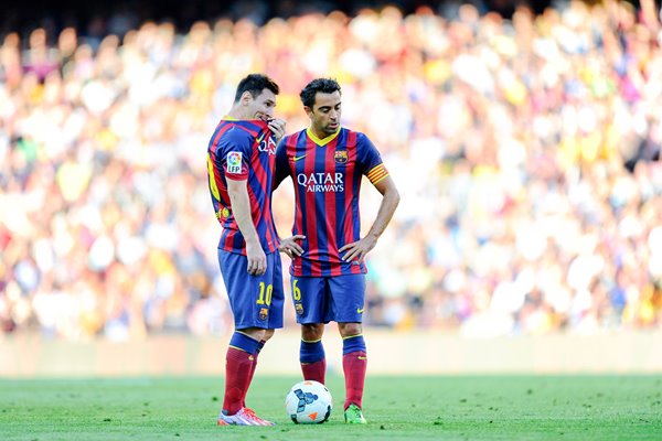 Lionel Messi and Xavi Hernandez