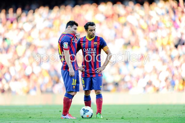 Lionel Messi and Xavi Hernandez