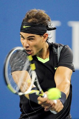 Rafael Nadal of Spain hits a return