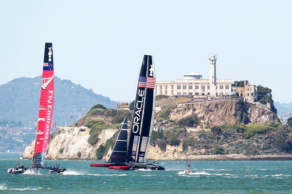 USA and New Zealand race beneath Alcatraz America's Cup 2013