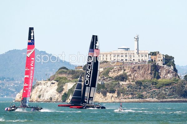 USA and New Zealand race beneath Alcatraz America's Cup 2013