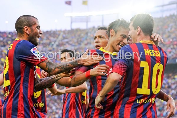 Neymar celebrates with Lionel Messi and team mates