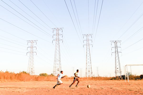 Children play football in Soweto 2010