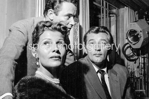 Rita Hayworth, Jack Lemmon and Robert Mitchum 1956