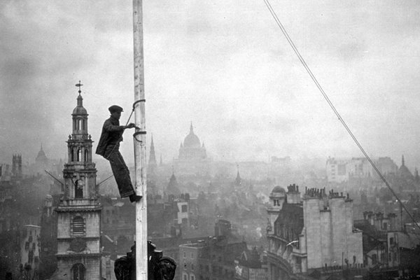 Steeplejack with view over London behind 1934
